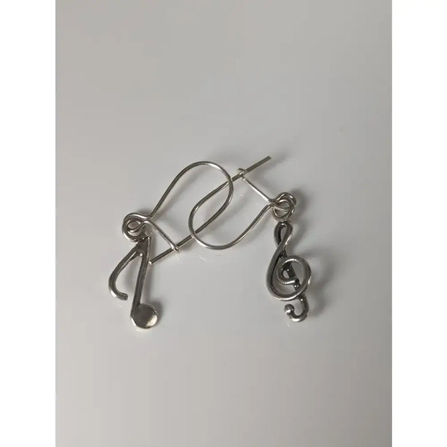 Silver steed clef and note dropped earrings in sleek silver with minimalist musical note design