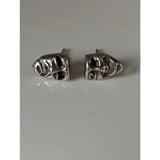 Silver steed skull shaped stud earrings with intricate engraved details perfect as steed comedy tragedy masks stud earrings
