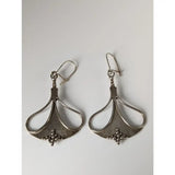 Silver steed crest dropped earrings with teardrop openwork design and small bead accents in silver finish