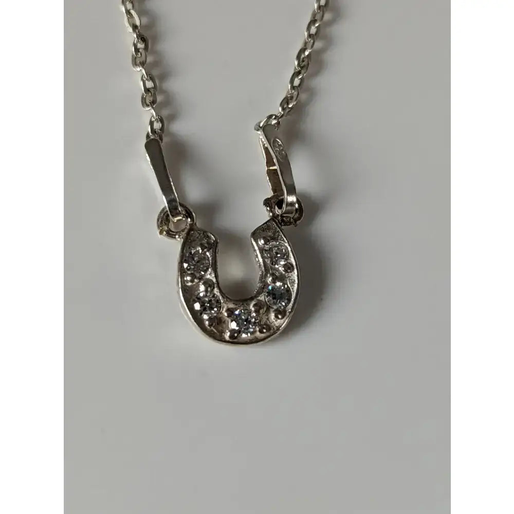 Silver steed crystal horseshoe necklace with clear rhinestones on silver pendant in stylish equestrian jewelry design
