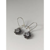 Silver steed crystal sunflower dropped earrings with handmade silver blackened petals and a clear central gemstone