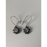 Silver steed crystal sunflower dropped earrings with handmade silver snowflake design and blackened metal petals