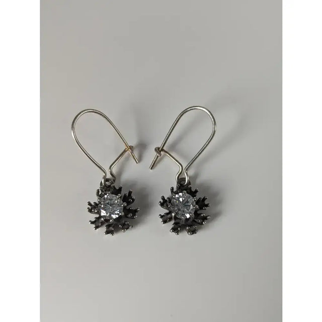 Silver steed crystal sunflower dropped earrings with handmade silver snowflake design and blackened metal petals