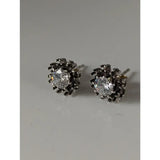 Black spider-themed sunflower stud earrings with silver steed crystal centers and detailed metallic design