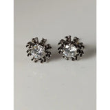 Silver steed crystal sunflower stud earrings shaped like spiders with clear crystals on silver legs