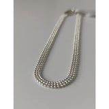 Silver steed curtain silver bracelet with silver-toned multi-strand beaded chain and sleek interlocking design