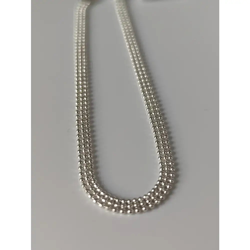 Silver steed curtain silver bracelet featuring a sleek multi strand silver beaded chain necklace design