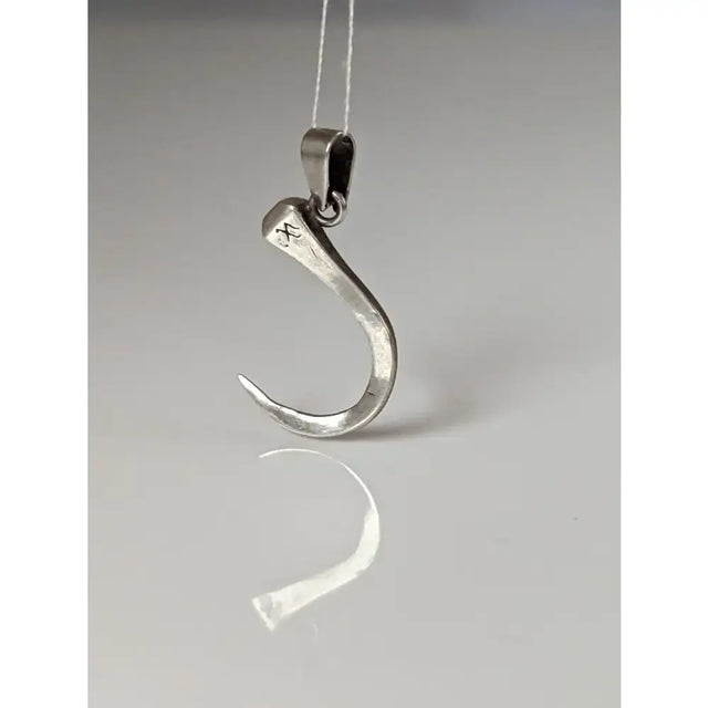 Silver steed curved horseshoe nail silver pendant with hammered texture and rustic engraved mark in silver tone