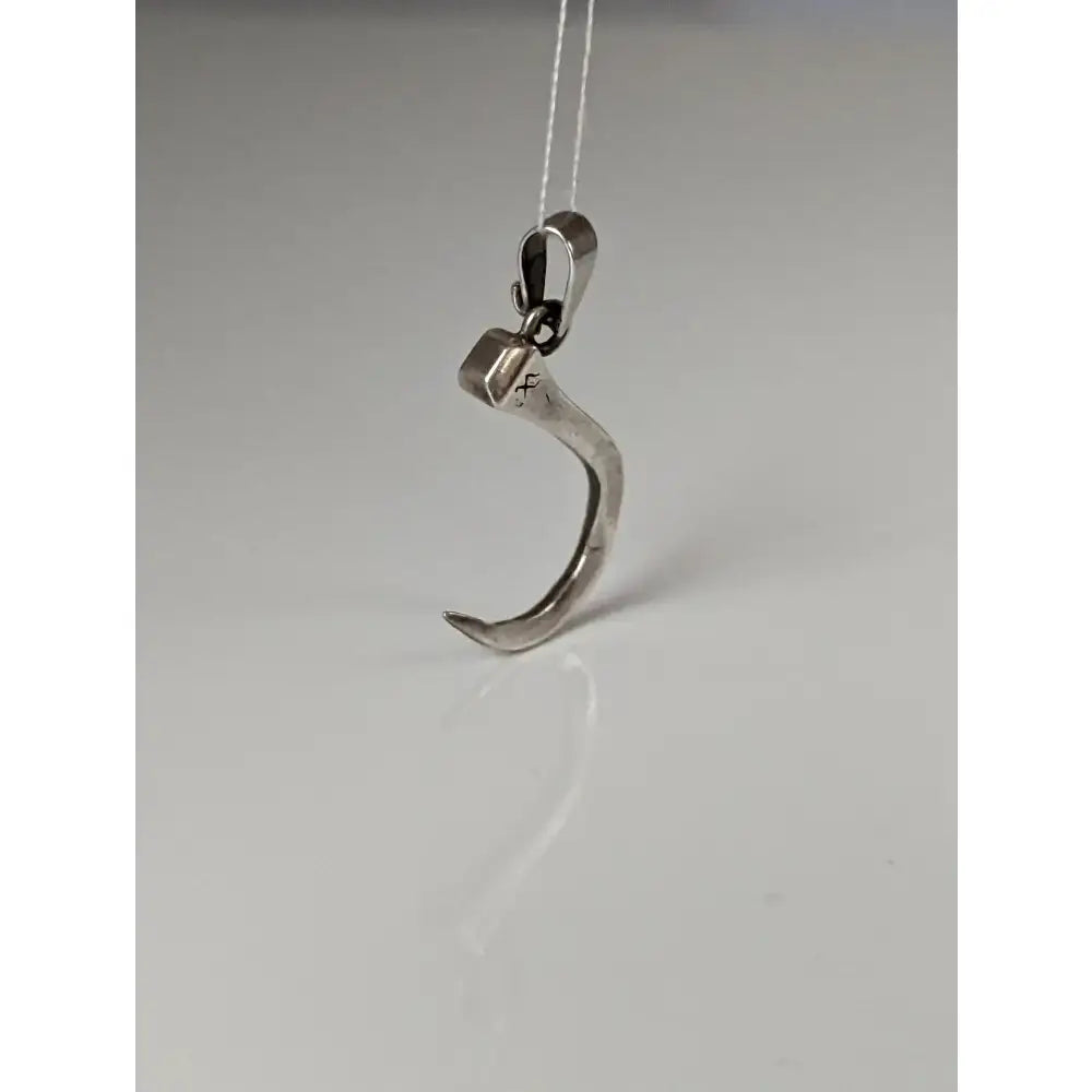 Silver steed curved horseshoe nail silver pendant in silver-toned metal shaped like a curved claw with clasp and square accent