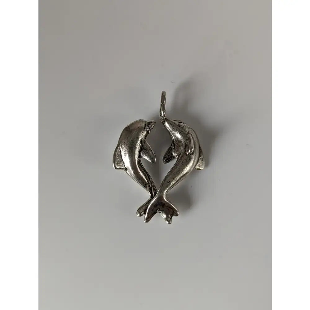 Silver steed dancing dolphins silver pendant featuring two detailed metal dolphins in a heart-shaped pose