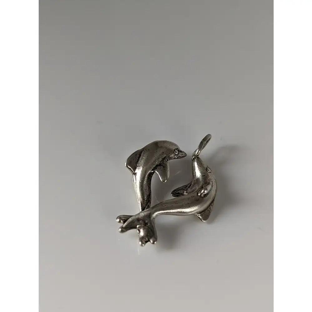 Silver steed dancing dolphins silver pendant with two polished metal dolphins leaping in mid-air with reflective finish
