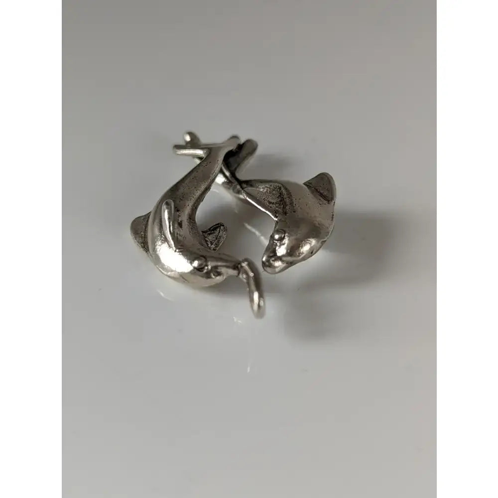 Silver steed dancing dolphins silver pendant featuring a detailed silver dolphin charm with a small attachment loop