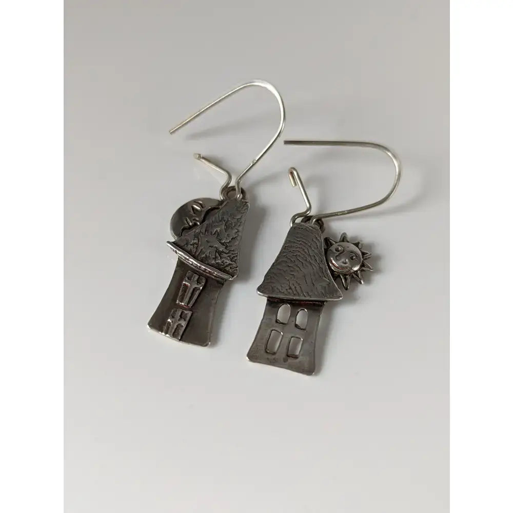 Silver steed day night house dropped earrings feature silver-toned textured roofs with sun and moon charms