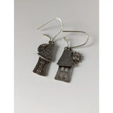 Silver steed day night house dropped earrings feature silver-toned textured roofs with sun and moon charms
