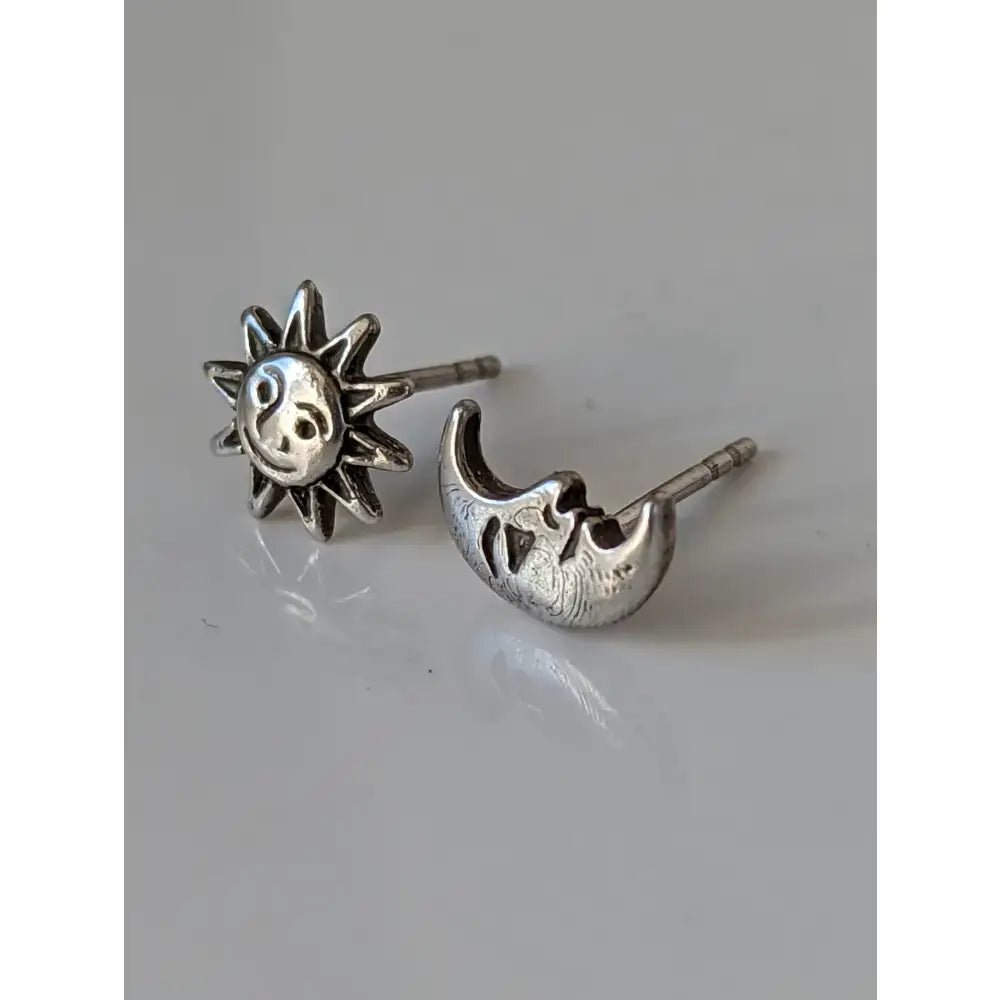 Silver steed day and night stud earrings featuring detailed silver sun and crescent moon night stud earrings