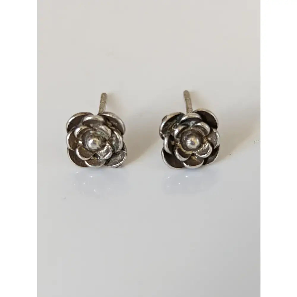 Silver steed delicate rose stud earrings featuring silver rose design with central pearl accent unique designs
