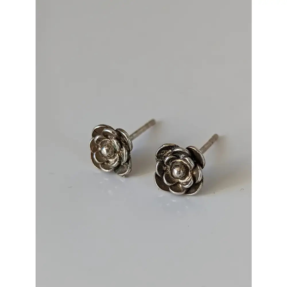 Silver steed delicate silver rose stud earrings with detailed petal design and polished metallic finish unique designs