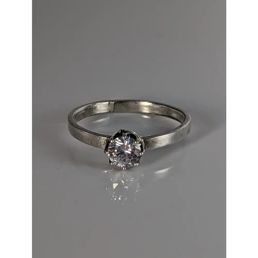 Silver steed delicate unique silver zirconia ring with a sleek silver band and round-cut clear gemstone in prong setting