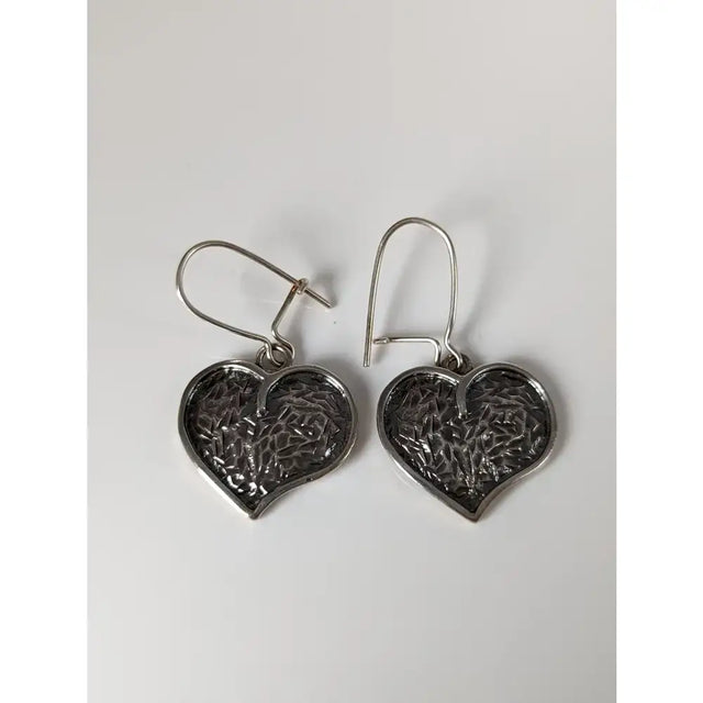 Silver steed detailed heart dropped earrings featuring intricate textured silver heart-shaped design