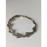 Silver steed detailed leaf silver bracelet with textured veins and secure clasp in shiny silver finish