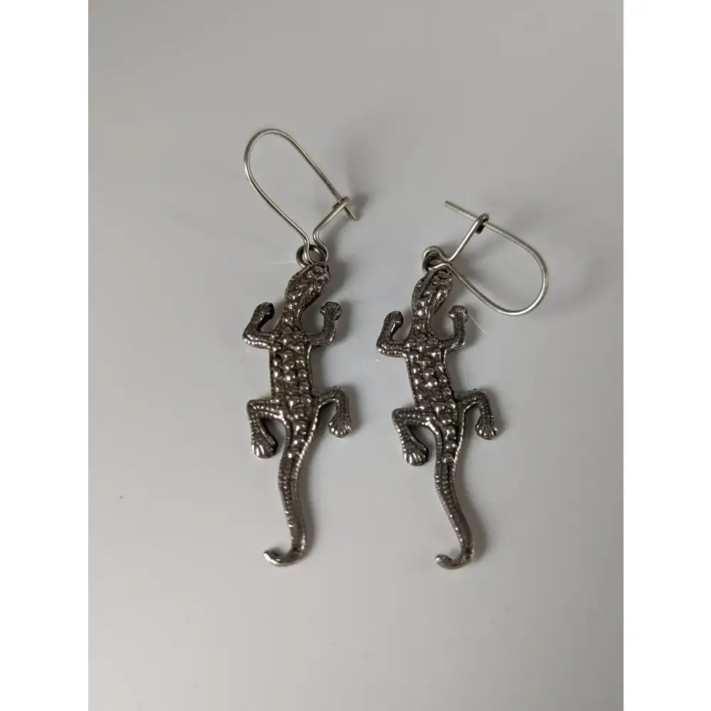 Silver steed detailed lizard silver dropped earrings with textured dotted surface and hook clasps