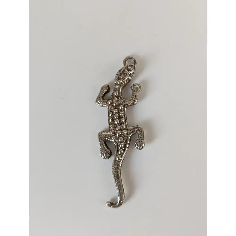 Silver steed detailed lizard silver pendant with textured surface and round embellishments perfect for equestrian jewelry