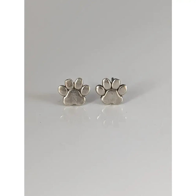 Silver steed sterling silver stud earrings featuring polished silver dog paws with a shiny metallic finish