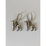 Silver steed dropped greyhound earrings are silver dog-shaped dropped greyhound earrings with intricate details and lever-back closures