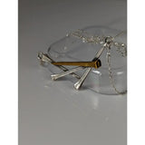 Silver steed elegant hoof nails necklace featuring a silver and gold nail pendant on a chain
