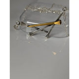Silver steed elegant hoof nails necklace with a silver and gold nail-shaped pendant on a chain