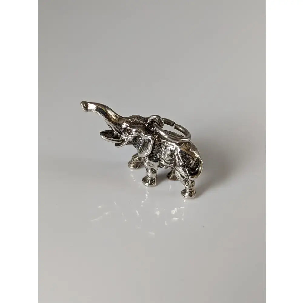Silver steed elephant silver pendant keychain with detailed craftsmanship and raised trunk in silver equestrian jewelry style