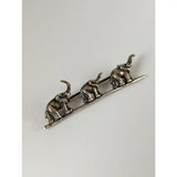 Silver steed elephants silver brooch with three detailed elephants walking on a slender silver bar pin