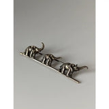 Silver steed elephants silver brooch with three detailed silver-toned elephants walking on a slender bar pin