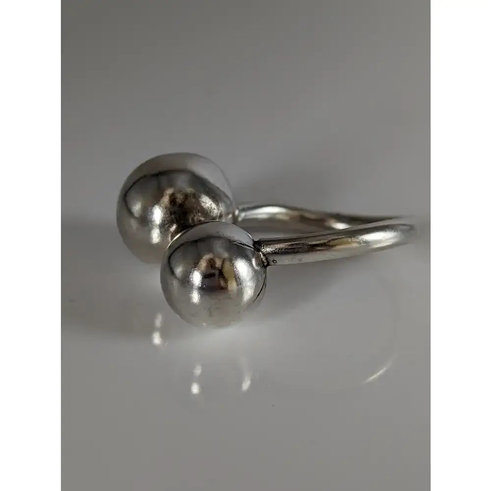 Silver steed extra large balls ring with two polished silver beads connected by a slender band in equestrian jewelry style