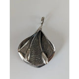 Silver steed extravagant leaf extravagant silver pendant with textured leaf and two small oval beads on thin stems