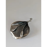 Silver steed extravagant silver pendant featuring a leaf shape with stems design and two small oval metal beads