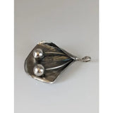 Silver steed extravagant silver pendant with leaf shape, two polished silver spheres, and small attachment loop