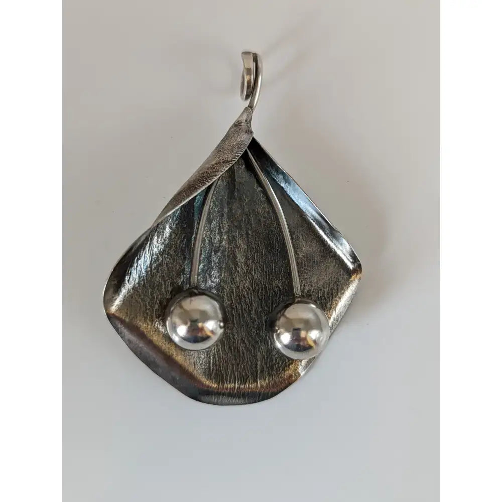 Silver steed extravagant silver pendant with leaf shape and two polished beads on thin stems silver pendant