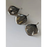Three handcrafted silver steed extravagant leaf pendants with embossed veins and delicate gold stems silver pendant accents