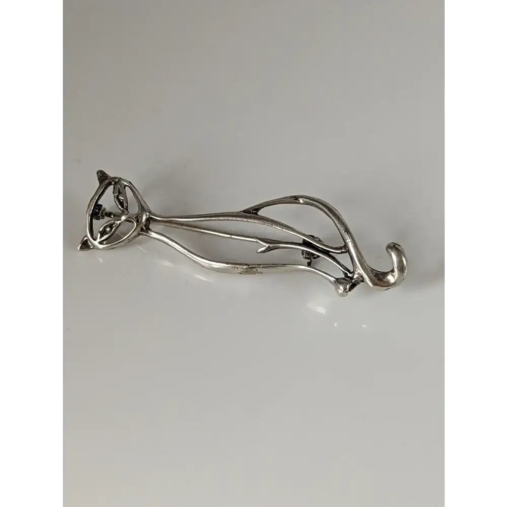 Silver steed feline silver brooch with flowing art nouveau curves and intricate filigree detailing in silver