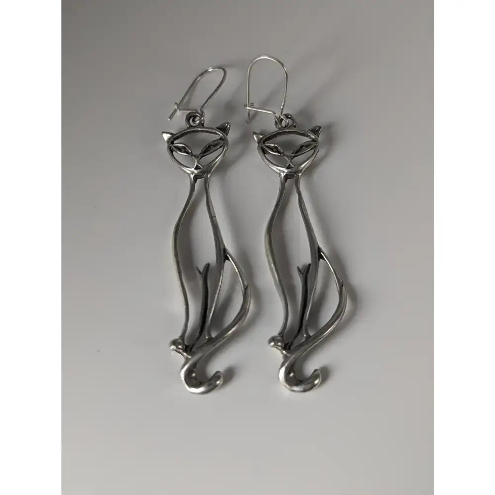 Silver steed feline silver dropped earrings featuring a sleek minimalist silver cat design dangle style