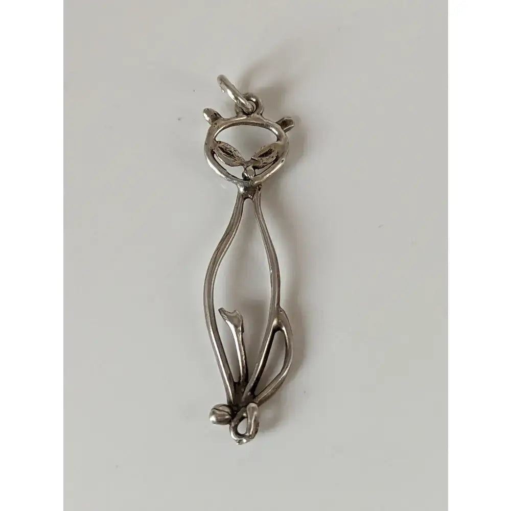 Silver steed feline silver pendant shaped like a cat with sleek minimalist design and delicate wirework detailing