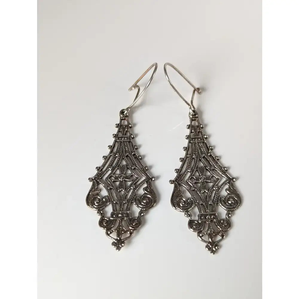 Silver steed filigree crest dropped earrings silver filigree drop earrings with intricate lace patterns and beads