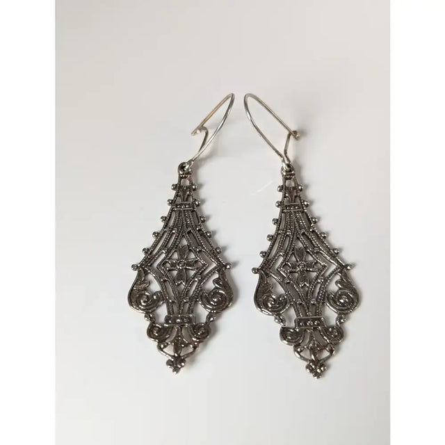 Silver steed filigree crest dropped earrings silver filigree drop earrings with intricate lace patterns and beads