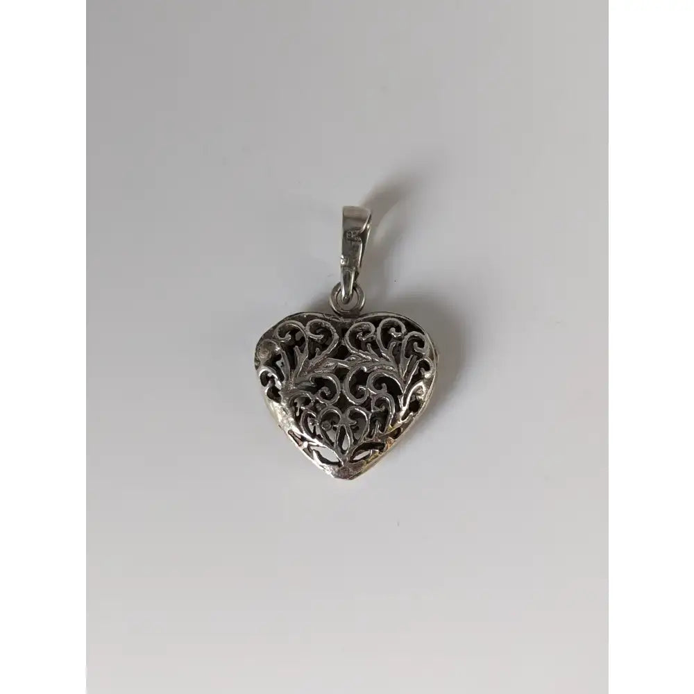 Silver steed filigree heart silver pendant featuring a handmade silver filigree design on a heart-shaped pendant