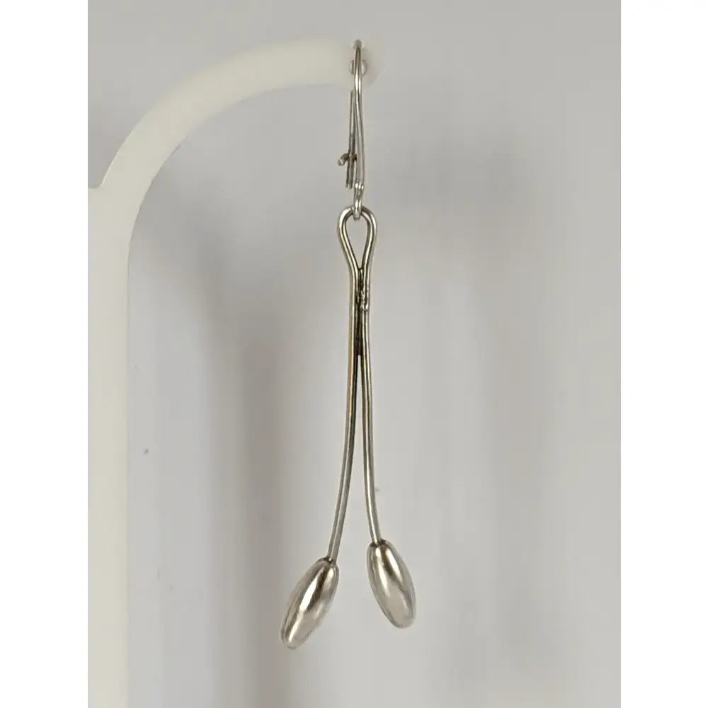 Silver steed flower stem dangling earrings with silver surgical forceps featuring polished handles and oval tips