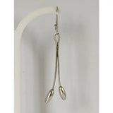 Silver steed flower stem dangling earrings with silver surgical forceps featuring polished handles and oval tips