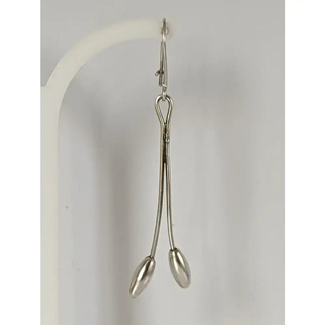 Silver steed flower stem dangling earrings with silver surgical forceps featuring polished handles and oval tips