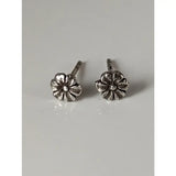 Silver steed flower stud earrings with detailed petals and a small central gem in a shiny silver finish