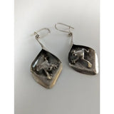 Silver steed frog leaf dangling earrings in sterling silver with hammered texture and hook closures